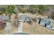 Aerial view of the home within a wooded neighborhood at 1090 Compton Way, Suwanee, GA 30024