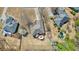 This aerial view shows the backyard with a deck, fire pit, pool, and a well-manicured lawn at 1090 Compton Way, Suwanee, GA 30024