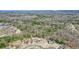 Beautiful aerial view of a traditional home surrounded by lush trees in a serene neighborhood at 1090 Compton Way, Suwanee, GA 30024