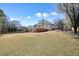 Large grassy backyard with an expansive deck and inviting fire pit area for outdoor enjoyment at 1090 Compton Way, Suwanee, GA 30024