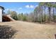 Large and level backyard with deck overlooking yard and trees at 1090 Compton Way, Suwanee, GA 30024