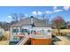 Beautiful backyard with a spacious deck, outdoor dining area, and pristine landscaping, perfect for outdoor living at 1090 Compton Way, Suwanee, GA 30024