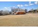 Large backyard with upper deck, mature trees and perimeter fencing at 1090 Compton Way, Suwanee, GA 30024