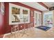 Bar area featuring stools, windows, and access to outside deck at 1090 Compton Way, Suwanee, GA 30024