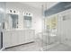 Bathroom features a double vanity, soaking tub, glass shower, and shiplap accents at 1090 Compton Way, Suwanee, GA 30024