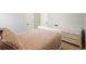 Calm bedroom with a plush bed, neutral walls, and classic white dresser at 1090 Compton Way, Suwanee, GA 30024