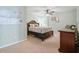 Cozy bedroom featuring soft carpet, calming paint and a beautiful wooden dresser at 1090 Compton Way, Suwanee, GA 30024