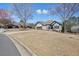 Charming home featuring a brick exterior, a two-car garage, and a spacious front yard at 1090 Compton Way, Suwanee, GA 30024