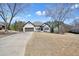 Charming home featuring a brick exterior, a two-car garage, and a large front yard at 1090 Compton Way, Suwanee, GA 30024