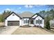 Charming home with two car garage and well-manicured landscaping at 1090 Compton Way, Suwanee, GA 30024