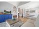 Open floor plan featuring living room with hardwood floors and seamless transition to the dining area at 1090 Compton Way, Suwanee, GA 30024