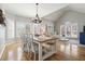 Bright and airy living room featuring hardwood floors, vaulted ceilings, and large windows with shutters at 1090 Compton Way, Suwanee, GA 30024