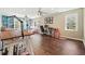 Bright home office with hardwood floors, built-in shelves, and plenty of natural light at 1090 Compton Way, Suwanee, GA 30024
