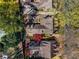 An aerial view of a well-maintained home with a shingle roof, landscaping, and mature trees at 3582 Grove Gate Ln, Atlanta, GA 30339