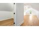 Bright, white attic space featuring wood floors and a storage nook at 3582 Grove Gate Ln, Atlanta, GA 30339