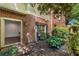 Backyard view from inside home with access to brick patio and lush landscaping at 3582 Grove Gate Ln, Atlanta, GA 30339