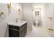 Modern bathroom with sleek fixtures, stylish lighting, and a glass-enclosed shower at 3582 Grove Gate Ln, Atlanta, GA 30339
