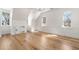 Bright bedroom with wood floors, white trim and three windows overlooking the verdant yard at 3582 Grove Gate Ln, Atlanta, GA 30339