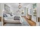 Bright bedroom features an overhead light, large windows and hardwood floors at 3582 Grove Gate Ln, Atlanta, GA 30339