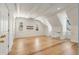 Attic bonus room with a vaulted ceiling and wood floors features exposed beams and natural light at 3582 Grove Gate Ln, Atlanta, GA 30339