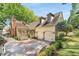 Exterior home view that showcases its two car garage with landscaping at 3582 Grove Gate Ln, Atlanta, GA 30339