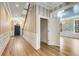 Elegant foyer with hardwood floors, stylish wallpaper, and detailed trim work at 3582 Grove Gate Ln, Atlanta, GA 30339