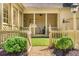 Inviting front yard with a picket fence and a charming gate leading to the house's porch at 3582 Grove Gate Ln, Atlanta, GA 30339