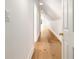 Attic hallway with hardwood floors and wainscoting offers bright natural lighting at 3582 Grove Gate Ln, Atlanta, GA 30339