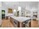 Open kitchen layout with large island, stainless appliances and access to Gathering room at 3582 Grove Gate Ln, Atlanta, GA 30339