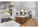 Gourmet kitchen with a center island and views into the living room at 3582 Grove Gate Ln, Atlanta, GA 30339