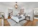 The main bedroom has carpet, a large overhead light and windows at 3582 Grove Gate Ln, Atlanta, GA 30339