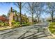 Charming traditional brick home with dormers and manicured landscaping along a tree-lined street at 3582 Grove Gate Ln, Atlanta, GA 30339