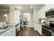 Modern kitchen with stainless steel appliances, granite counters and view into dining room at 526 Lanier Way, Temple, GA 30179