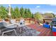 Inviting back deck featuring a seating area, umbrella, and outdoor grill at 85 Ann Se Cir, Cartersville, GA 30121