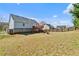 Spacious backyard with a wooden fence, tree line, and grass at 85 Ann Se Cir, Cartersville, GA 30121
