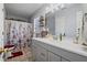Charming bathroom featuring gray cabinets, a white sink, and decorative shelves for storage and style at 85 Ann Se Cir, Cartersville, GA 30121