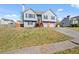 Charming two-story home with a manicured lawn, two car garage, and inviting front entrance at 85 Ann Se Cir, Cartersville, GA 30121