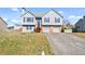 Charming two-story home with a two-car garage and inviting curb appeal on a sunny day at 85 Ann Se Cir, Cartersville, GA 30121
