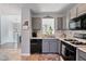 Efficiently designed kitchen with stainless steel appliances and gray cabinetry at 85 Ann Se Cir, Cartersville, GA 30121