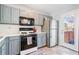 Well-equipped kitchen with stainless steel appliances, gas range, and ample counter space for culinary enthusiasts at 85 Ann Se Cir, Cartersville, GA 30121