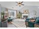 Bright living room featuring a fireplace, large windows, and vaulted ceiling with stylish furnishings at 85 Ann Se Cir, Cartersville, GA 30121