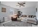 Comfortable living room featuring a ceiling fan, neutral palette, and plush carpet at 85 Ann Se Cir, Cartersville, GA 30121
