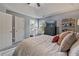 Serene bedroom featuring a tray ceiling, plush bedding, and a decorative shelf for displaying personal items at 85 Ann Se Cir, Cartersville, GA 30121