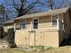 Photo of the home's back exterior and small deck at 1415 Dodson Sw Dr, Atlanta, GA 30311