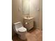 Cozy bathroom features a sink with cabinet, and a toilet at 1415 Dodson Sw Dr, Atlanta, GA 30311