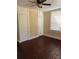 Bedroom with hardwood floors, natural light, and closet space at 1415 Dodson Sw Dr, Atlanta, GA 30311