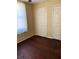 Bedroom with hardwood floors and closet at 1415 Dodson Sw Dr, Atlanta, GA 30311