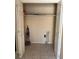 Utility closet with ceramic tile flooring, and an outlet for a dryer at 1415 Dodson Sw Dr, Atlanta, GA 30311