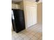 Kitchen featuring black refrigerator and additional storage space at 1415 Dodson Sw Dr, Atlanta, GA 30311
