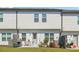 Backyard patio with outdoor seating and grill, overlooking a lush lawn and flowerbeds at 1484 Ben Park Way, Grayson, GA 30017